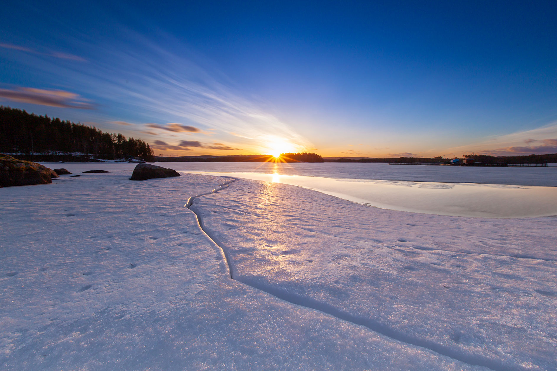 Sunrise over snow-covered landscape