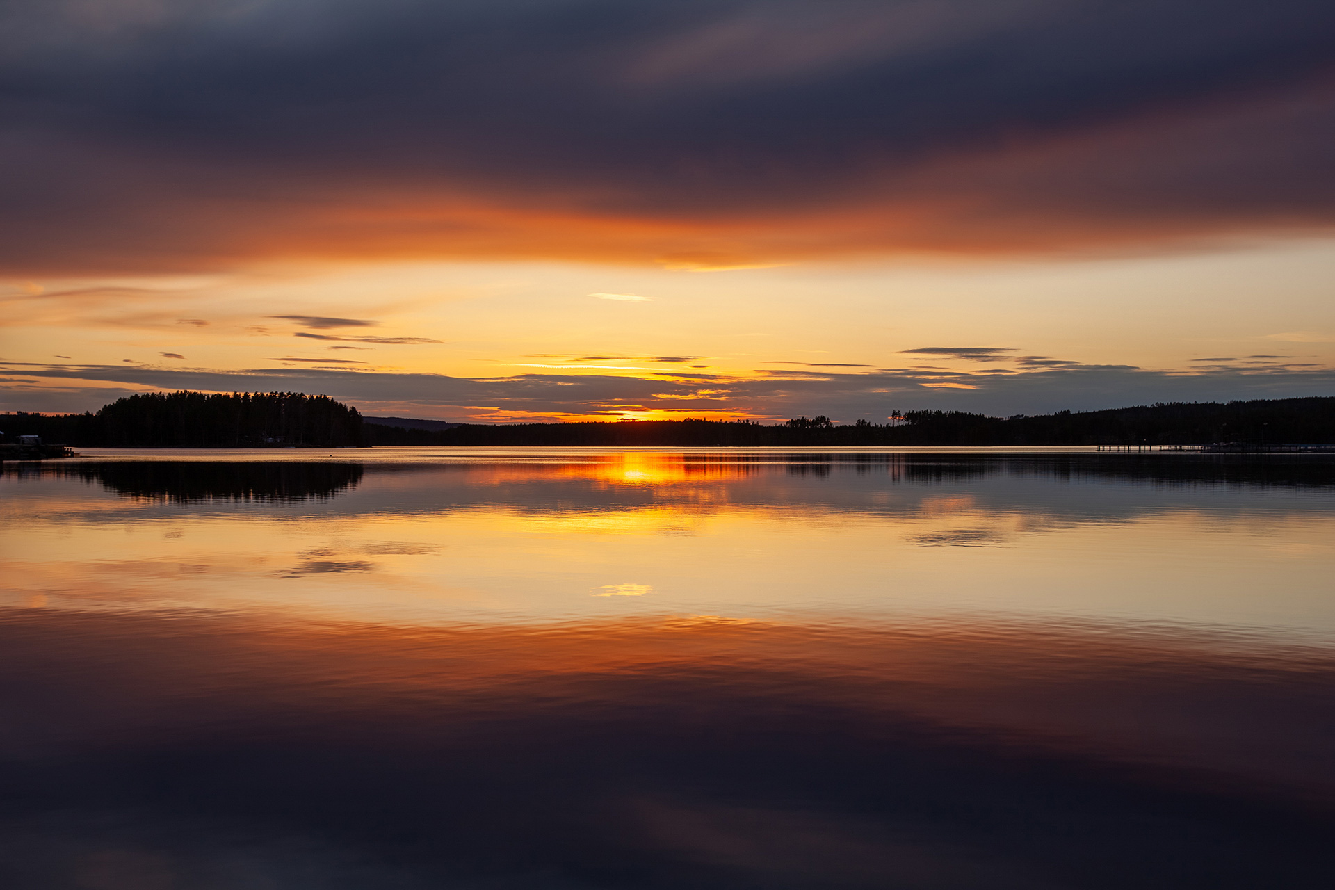 Sunset horizon over a Nordic landscape